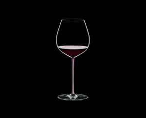 RIEDEL Fatto A Mano Pinot Noir Pink R.Q. filled with a drink on a black background