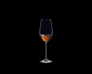 RIEDEL Ouverture Sherry filled with a drink on a black background
