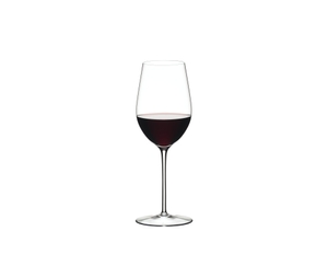 A RIEDEL Sommeliers Zinfandel/Riesling Grand Cru glass filled with white wine on white background. The Sommeliers logo below the glass.