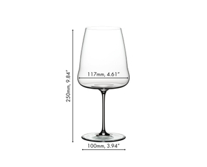A RIEDEL Winewings Cabernet/Merlot glass filled with red wine on a white background.