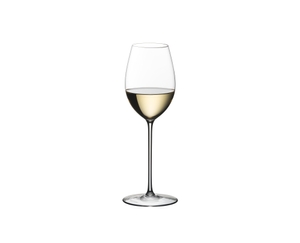 Blonde woman in a white summer dress with a white wine filled RIEDEL Superleggero Loire glass in her hand