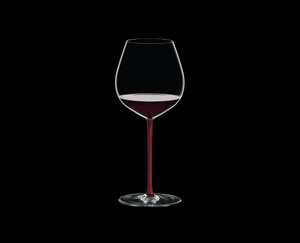 RIEDEL Fatto A Mano Pinot Noir Red R.Q. filled with a drink on a black background