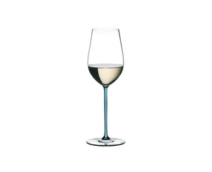 A RIEDEL Fatto A Mano Riesling with a turquoise stem and filled with white wine on a white background.