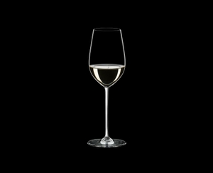 RIEDEL Fatto A Mano Riesling/Zinfandel White R.Q. filled with a drink on a black background