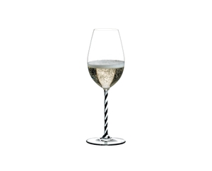 RIEDEL Fatto A Mano Champagne Wine Glass Black & White R.Q. filled with a drink on a white background