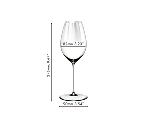 A RIEDEL Perfromance Sauvignon Blanc glass filled with white wine on a white background.