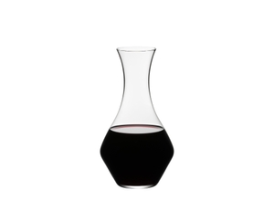 RIEDEL Decanter Cabernet filled with a drink on a white background