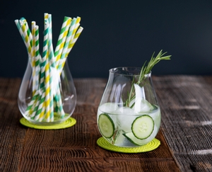 4 decorated gin cocktails served in RIEDEL Gin glasses stand slightly offset side by side on a white background