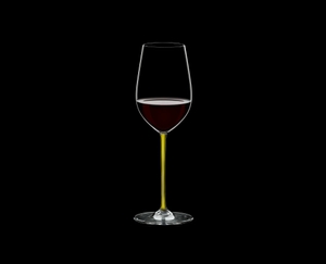 RIEDEL Fatto A Mano Riesling/Zinfandel Yellow filled with a drink on a black background