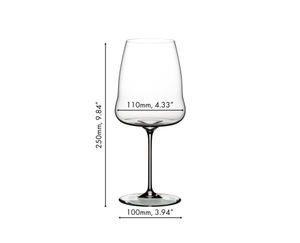 A RIEDEL Winewings Syrah glass filled with red wine on a white background.