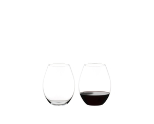 Two RIEDEL Wine Friendly Tumbler side by side against a white background. The glass on the left side is empty, the glass on the right side is filled with red wine. Two RIEDEL Wine Friendly Tumbler side by side against a white background. The glass on the left side is empty, the glass on the right side is filled with red wine.
