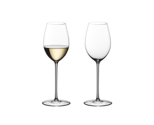 Two RIEDEL Superleggero Loire glasses side by side. The wine glass on the left side is filled with white wine, the other one is empty