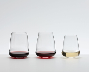 A SL RIEDEL Stemless Wings Cabernet/Merlot glass filled with red wine on a white background.
