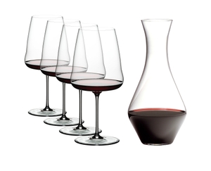 4 RIEDEL Winewings Cabernet Sauvignon glasses and 1 Cabernet Magnum Decanter filled with red wine