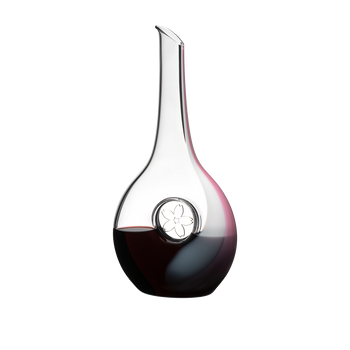 One red wine filled RIEDEL Sakura Decanter on white background