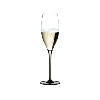 RIEDEL Sommeliers Black Tie Vintage Champagne Glass filled with a drink on a white background