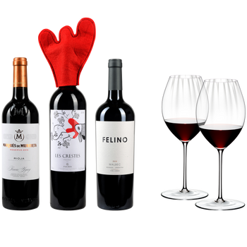 3 different closed bottles of red wine side by side and next to 2 red wine filled RIEDEL Performance Syrah/Shiraz glasses on white background.
