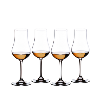 Four RIEDEL Rum glasses filled with rum side by side.