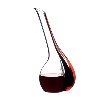 A RIEDEL Black Tie Touch Decanter Red with a black/red/black stripe and filled with red wine on a white background.