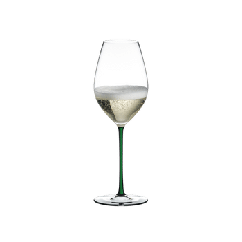 RIEDEL Fatto A Mano Champagne Wine Glass Green filled with a drink on a white background