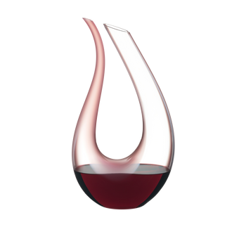 RIEDEL Decanter Amadeo Rosa filled with a drink on a white background