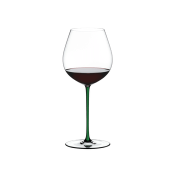 RIEDEL Fatto A Mano Pinot Noir Green filled with a drink on a white background