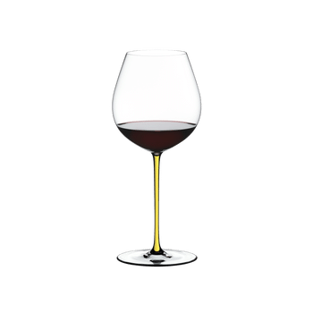 RIEDEL Fatto A Mano Pinot Noir Yellow filled with a drink on a white background