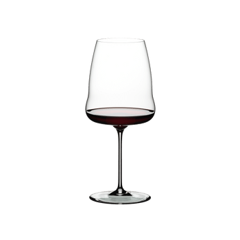 RIEDEL Winewings Syrah filled with a drink on a white background