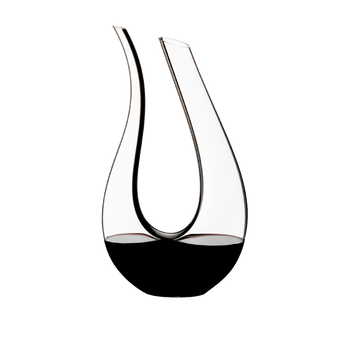 RIEDEL Amadeo Decanter Black Tie filled with a drink on a white background