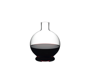 RIEDEL Decanter Marne filled with a drink on a white background