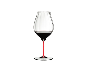 A RIEDEL Fatto A Mano Performance Pinot Noir glass with red stem filled with red wine.