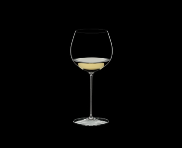 RIEDEL Superleggero Oaked Chardonnay filled with a drink on a black background