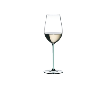 A RIEDEL Fatto A Mano Riesling with a mint colored stem and filled with white wine.