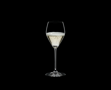 RIEDEL Extreme Restaurant Prosecco Superiore filled with a drink on a black background