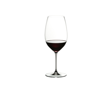 RIEDEL Veritas New World Shiraz filled with a drink on a white background
