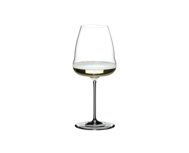 A RIEDEL Winewings Champagne Wine Glass filled with champagne on a white background.