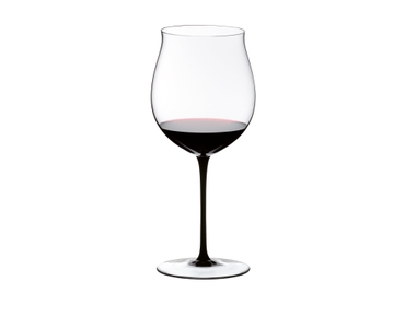 RIEDEL Sommeliers Black Tie Burgundy Grand Cru filled with a drink on a white background