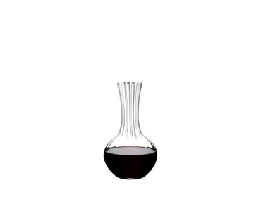 RIEDEL Performance Decanter filled with a drink on a white background