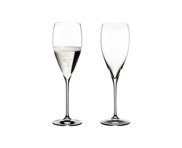Two RIEDEL Vinum Vintage Champagne Glasses. One is unfilled, the other one is filled with Champagne.