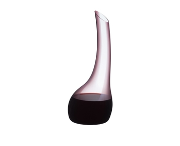 A RIEDEL Cornetto Confetti Decanter Pink filled with red wine on a white background.