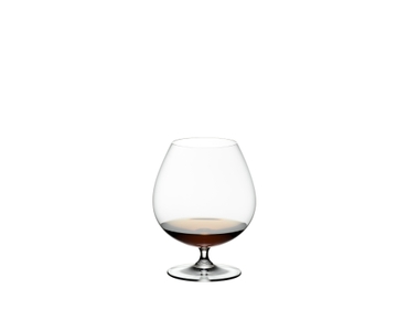 RIEDEL Vinum Brandy filled with a drink on a white background