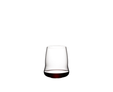 Brunette lady holds a red wine filled SL RIEDEL Stemless Wings Cabernet Sauvignon glass in her hand