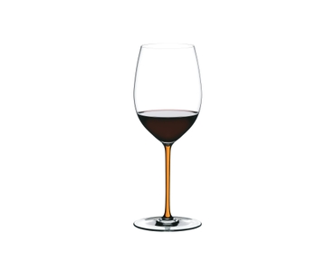 A RIEDEL Fatto A Mano Cabernet/Merlot glass in orange filled with red wine on a transparent background. 