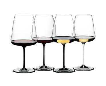 The RIEDEL Winewings Cabernet/Merlot glass, the RIEDEL Winewings Pinot Noir/Nebbiolo glass, the RIEDEL Winewings Sauvignon Blanc glass and the RIEDEL Winewings Chardonnay glass are standing next to each other filled with the matching wine for each glass on a white background.
