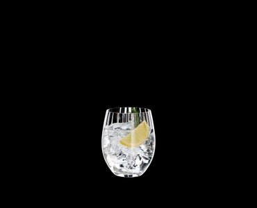 RIEDEL Tumbler Collection Optical O Long Drink filled with a drink on a black background