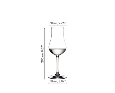 A RIEDEL Aquavit glass filled with Aquavit against a white background.