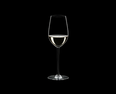 RIEDEL Fatto A Mano Riesling/Zinfandel Black filled with a drink on a black background