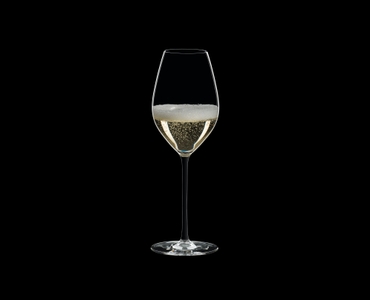 RIEDEL Fatto A Mano Champagne Wine Glass Black R.Q. filled with a drink on a black background