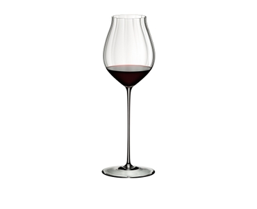 RIEDEL High Performance Pinot Noir Clear filled with a drink on a white background