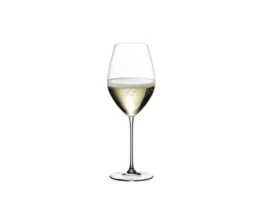Two RIEDEL Veritas Champagne Wine Glasses and two O Wine Tumbler Riesling Sauvignon Blanc glasses on a golden table.